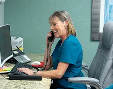 Liz answering the phone