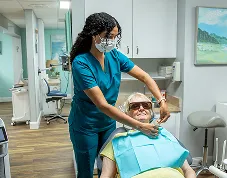 Jenni helping a patient